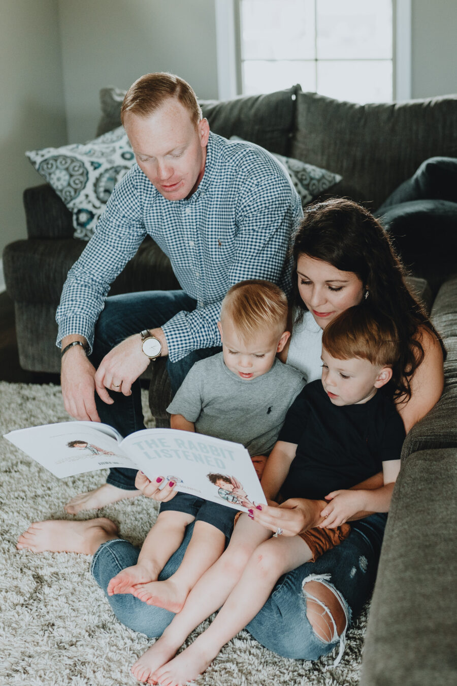 Family reading a book together | In-home family session by Five Pence Photography | Nashville Baby Guide