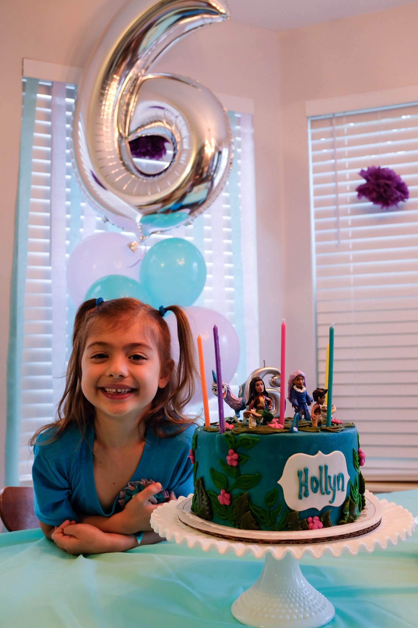 girl next to birthday cake